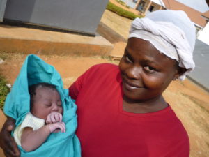 Mum and baby in knitted vest - Uganda 2012